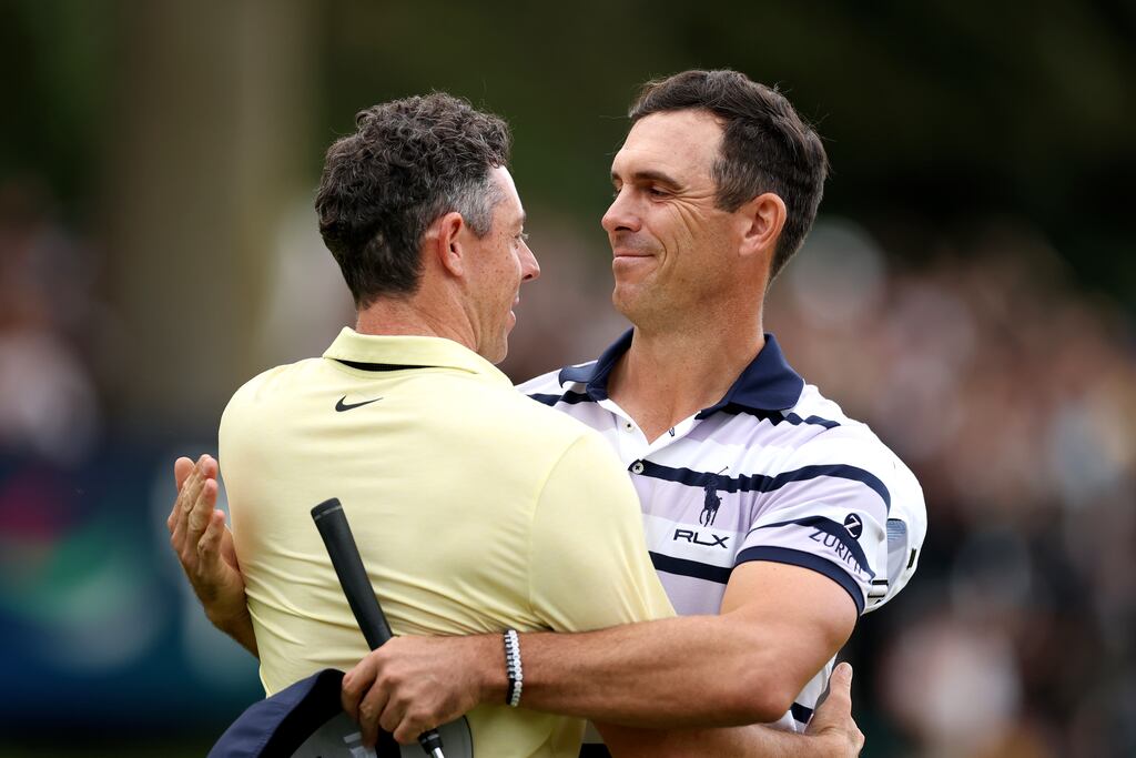 Billy Horschel of the United States celebrates on the 18th green with Rory McIlroy following victory after the second play-off hole at BMW PGA Championship. Photograph: Richard Heathcote/Getty Images