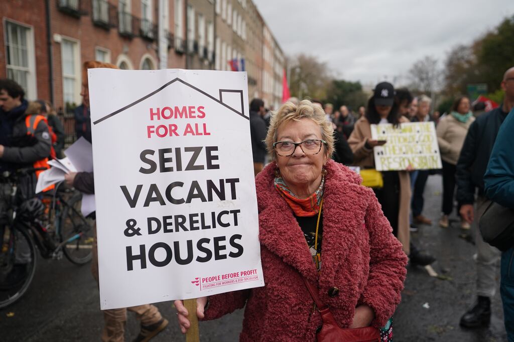 A woman takes part in a Raise the Roof rally in Dublin. The protest is over the country's ongoing housing crisis.