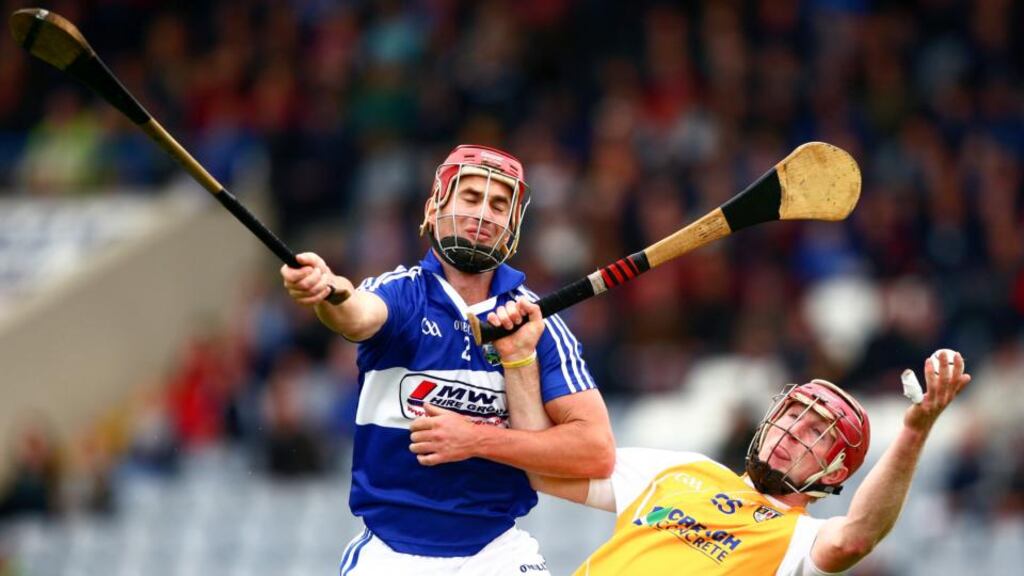 Laois’s John A Delaney  battles for possession with  Antrim’s PJ O’Connell during the  Leinster senior hurling qualifier round five match at  O’Moore Park, Portlaoise. Photograph: Inpho