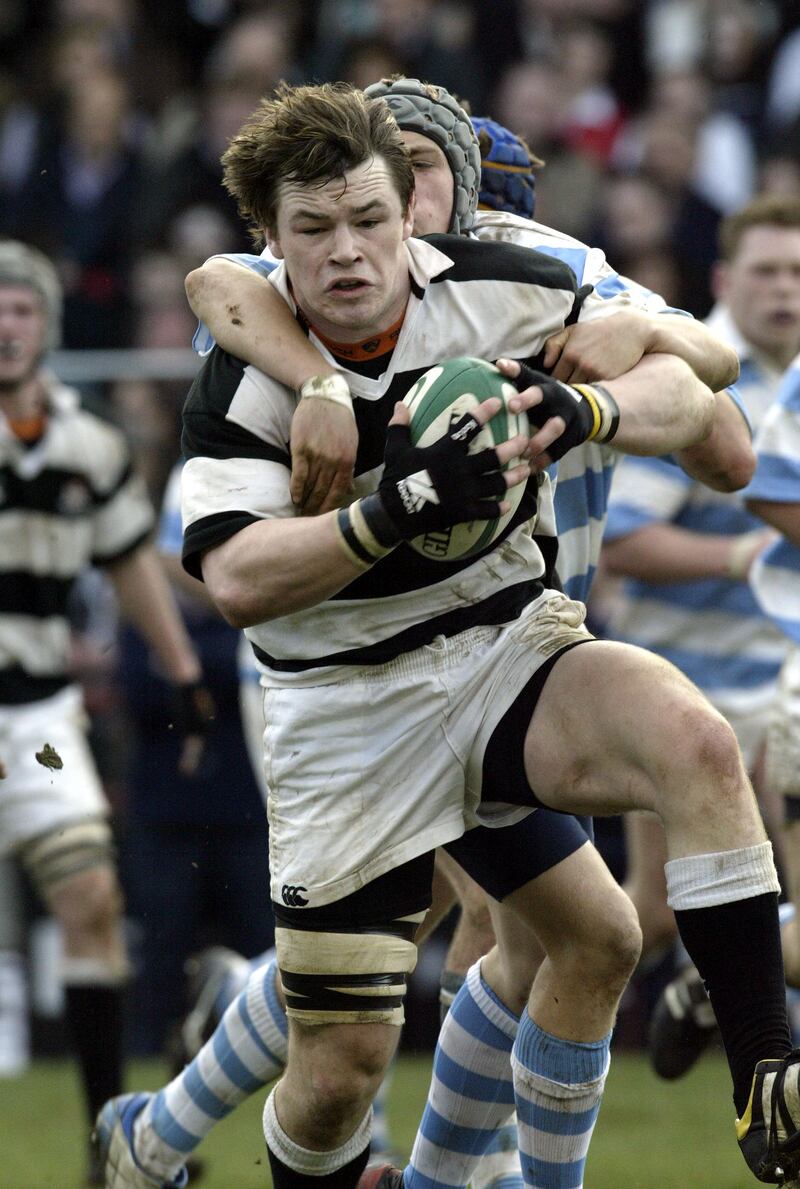 Belvedere's Cian Healy is tackled by Ian Madigan of Blackrock in the 2005 Leinster Schools Senior Cup final. Photograph: Donall Farmer/Inpho