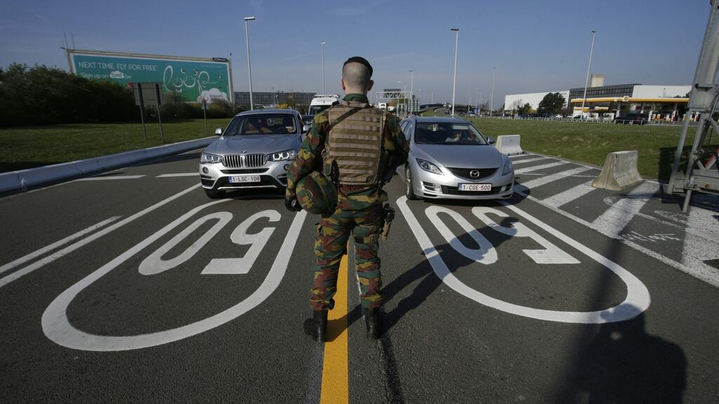 A soldier monitors motorists arriving at Brussels airport in Zaventem. Photograph: Thierry Roge /AFP/Getty Images