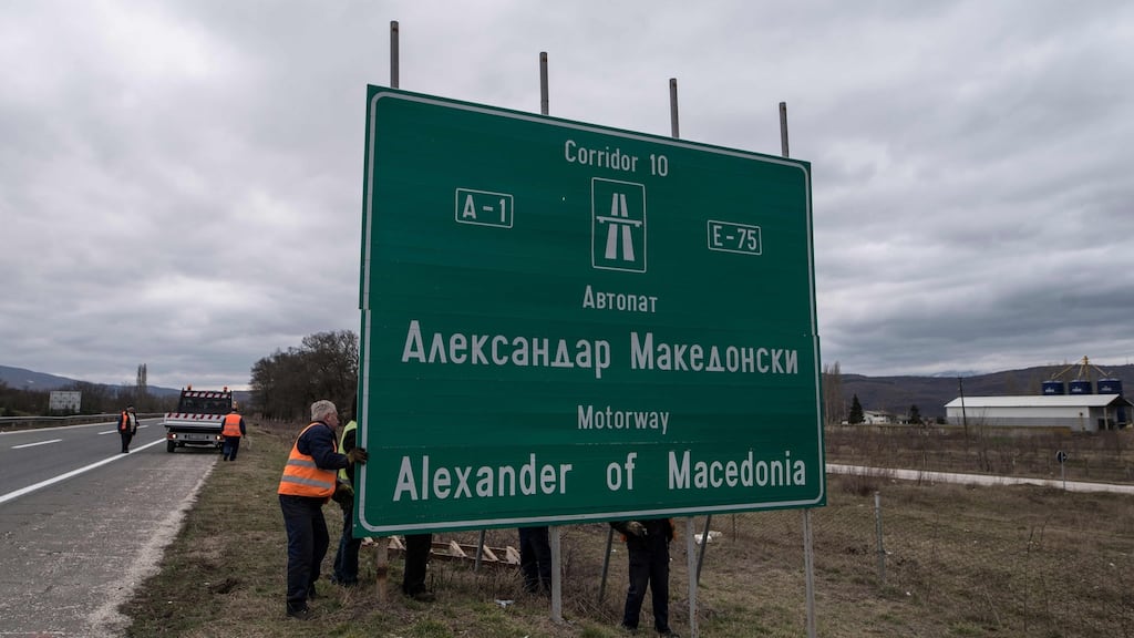 Workers remove a sign with the former name of the highway leading to the Greek border, “Alexander of Macedonia”, newly renamed “Friendship Highway”, near Skopje on February 21st. The government decided to change the name of the highway, along with the name of the Skopje airport, following the name dispute with Greece. Photograph: Robert Atanasovski/Getty Images