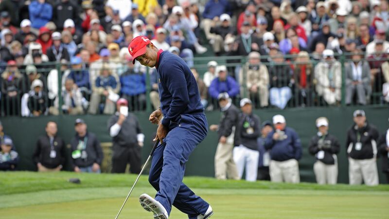 Tiger Woods reacts after sinking a birdie putt on the ninth hole during the final round singles matches for the Presidents Cup at Harding Park Golf Club  in San Francisco on October 11th, 2009. Photograph: Chris Condon/PGA Tour