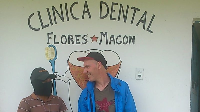 Michael McCaughan and his “votan”, or guadian, David, in front of the dental clinic in Moises Gandhi. Photograph: Sergio Chua