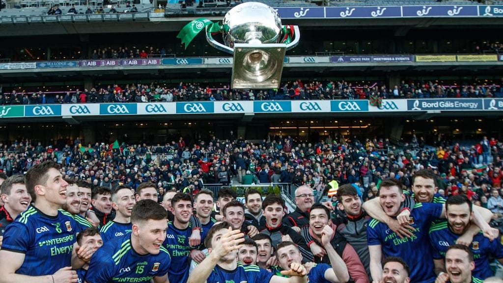 Mayo’s Fergal Boland celebrates by throwing the trophy in the air after the victory over Kerry in the Allianz Football League Division 1 Final at Croke Park. Photograph: James Crombie/Inpho