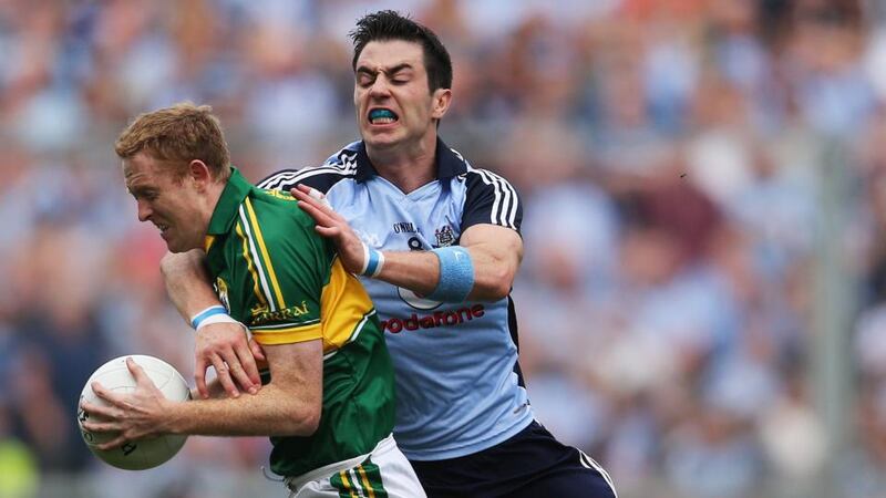 Dublin’s Michael Darragh Macauley tackles Kerry’s Colm Cooper. Photo: Cathal Noonan/Inpho