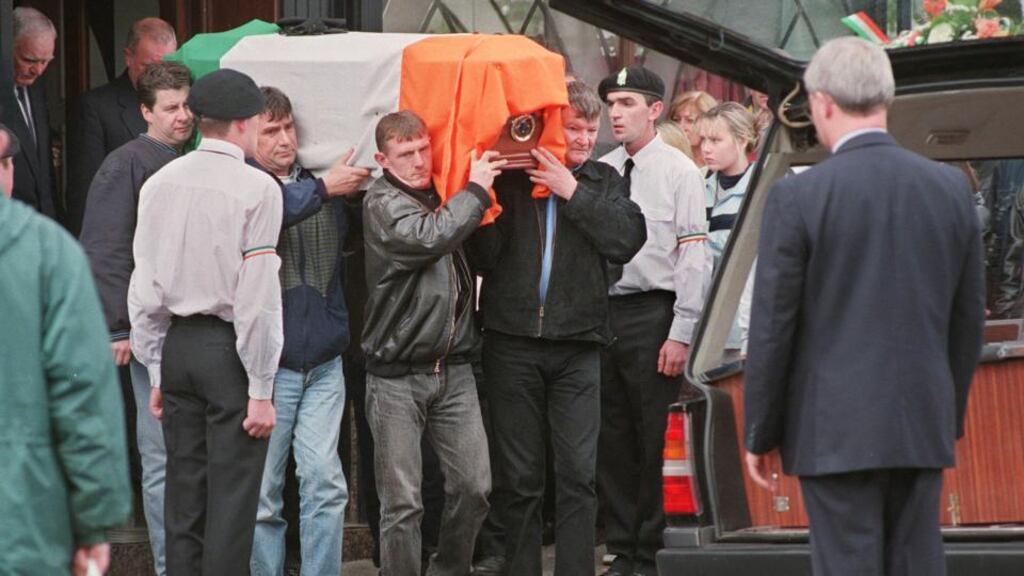 A file photos from 1998 showing a  colour party forming a guard of honour for the body of   Ronan MacLochlainn prior to his funeral. Photograph: The Irish Times