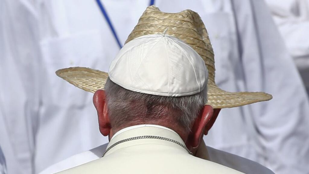 Pope Francis is greeted by Cuba’s president Raul Castro (back) as he arrives to lead a mass in the city of Holguín. Photograph: Tony Gentile/EPA