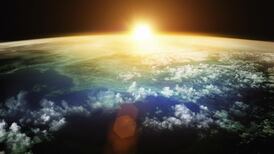 Boiling oceans and red-hot skies triggered by early asteroid