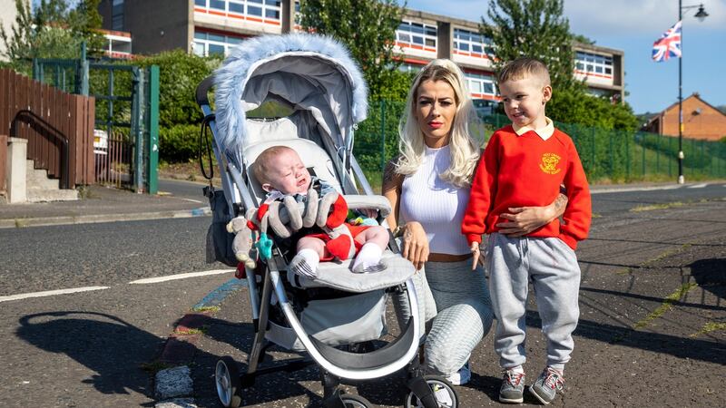 Alice-Lee Bunting, who attended Holy Cross Girls’ School Belfast 20 years ago during the Holy Cross dispute in Ardoyne, north Belfast, with her sons Darraigh Bunting (4) and Keaghan Tommy Bunting (8 months). Photograph: Liam McBurney/PA Wire