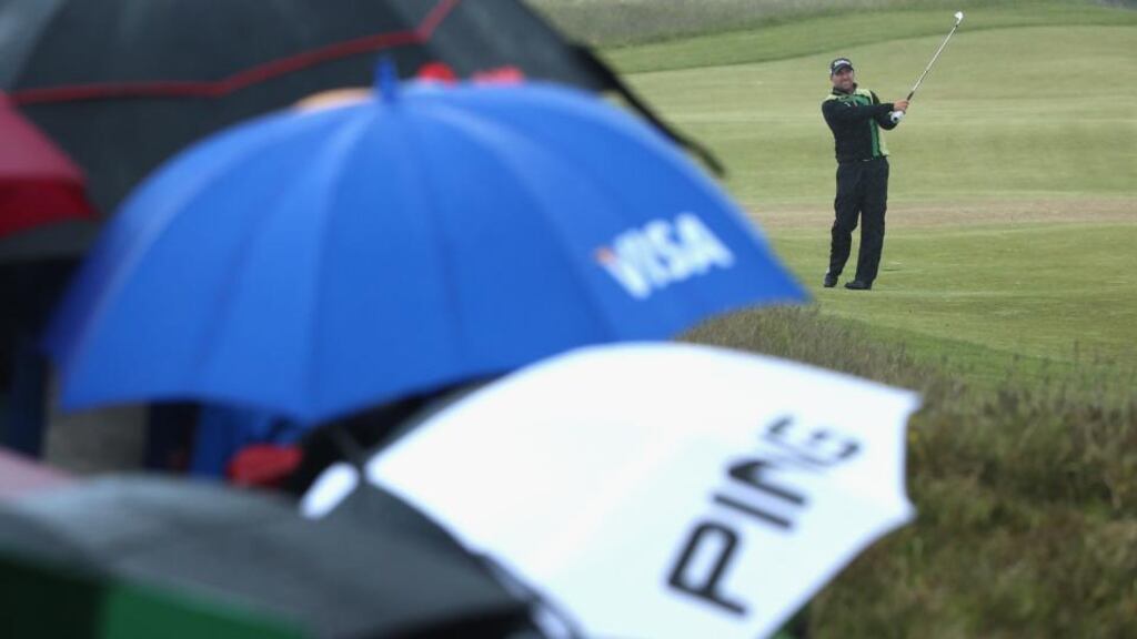 Darren Fichardt of South Africa hits his 2nd shot on the 18th hole during the final round of the Dubai Duty Free Irish Open. “As much as they are loving coming here they are not exactly loving the conditions,” said Pádraig Harrington. Photograph: Andrew Redington/Getty Images