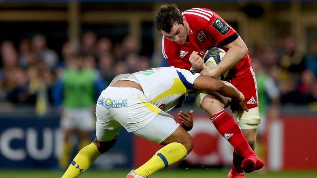Clermont’s Wesley Fofana puts in a tackle on Munster’s Peter O’Mahony. Photo: James Crombie/Inpho