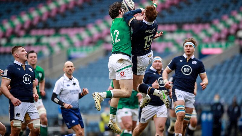 Robbie Henshaw competes in the air with Stuart Hogg. Photo: Tommy Dickson/Inpho