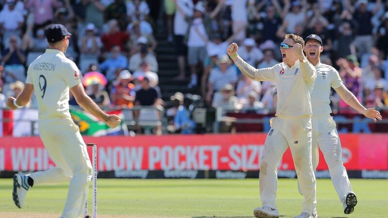 Dom Bess (R) celebrates after taking the key wicket of Dean Elgar at Newlands. Photograph: Halden Krog/AP