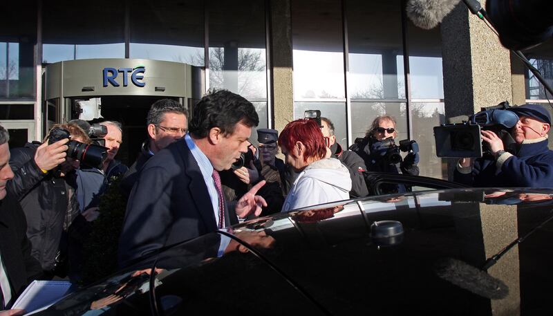 Then minister for finance Brian Lenihan leaves RTÉ following a radio interview. Photograph: Eric Luke