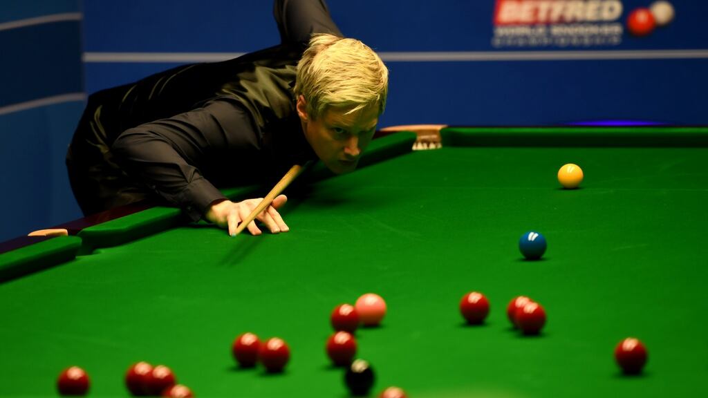 Neil Robertson lines up a shot against Noppon Saengkham during their first round match of the World Snooker Championship at the Crucible Theatre  in Sheffield. Photograph: Gareth Copley/Getty Images
