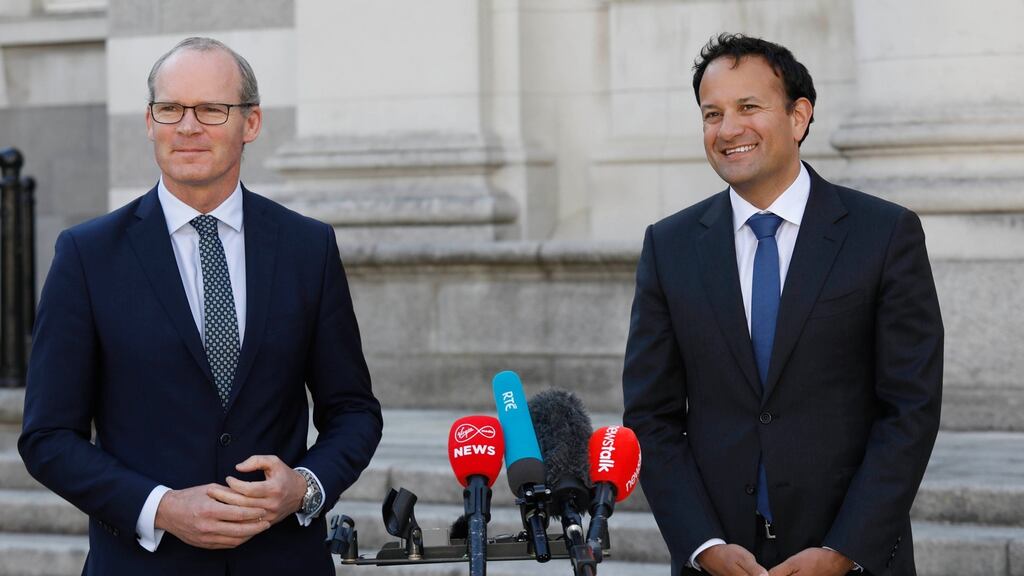 Taoiseach and Fine Gael leader Leo Varadkar (right) and Tánaiste Simon Coveney speaking to the media at Government Buildings in Dublin on Monday. Photograph: Leon Farrell/Photocall Ireland/PA Wire.