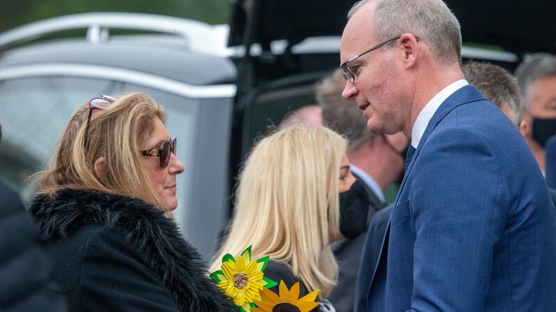 Michelle Ross-Stanton, wife of the late Pierre Zakrzewski, speaks to Minister for Foreign Affairs Simon Coveney at her husband’s funeral. Photograph: Tom Honan for The Irish Times