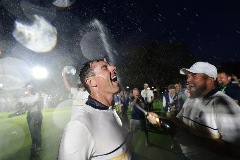 Shane Lowry sprays Rory McIlroy with champagne as Europe celebrate winning the 2025 Ryder Cup. Photograph: Carl Recine/Getty Images