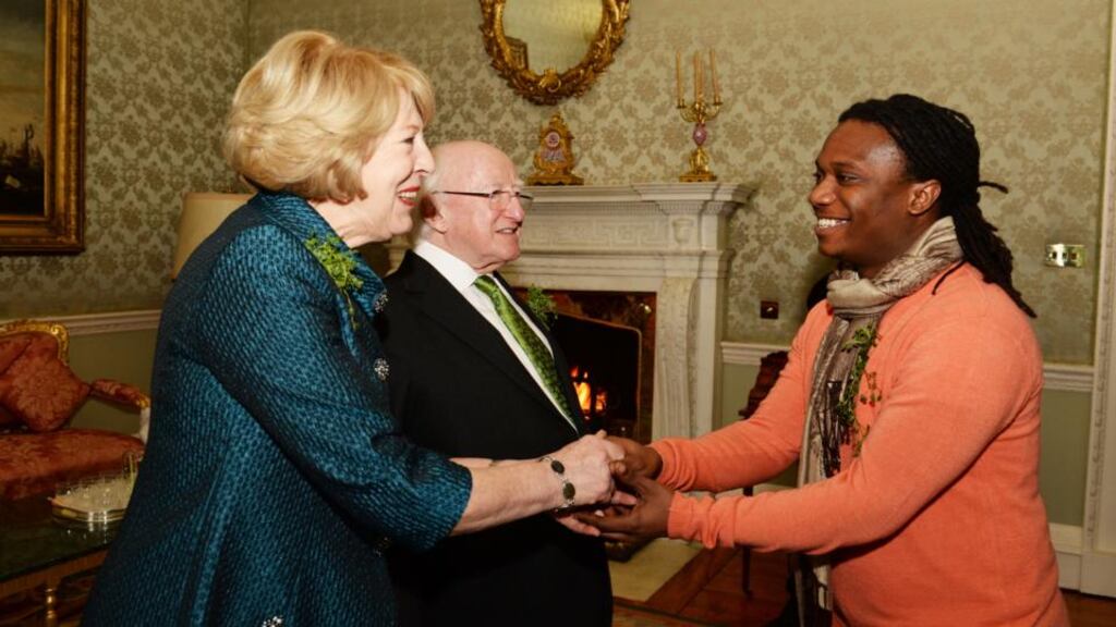 Edward Russell from the Cairdeas project meeting President Michael D Higgins and his wife Sabina at Áras an Uachtaráin yesterday,  where   a St Patrick’s Day reception  was  hosted for some 120 volunteers who work with the homeless.  Photograph: Cyril Byrne/The Irish Times
