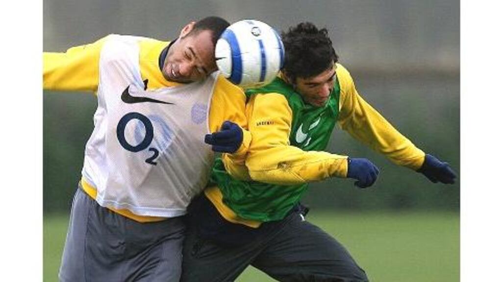 Arsenal's Thierry Henry and Jose Antonio Reyes challenge each other during a training session at the club's London Colney training ground yesterday ahead of tonight's Champions League first leg quarter-final match against Serie A leaders Juventus at Highbury.