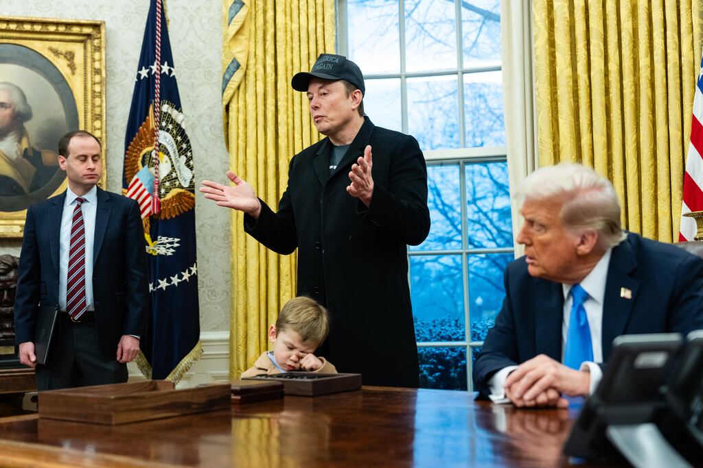 President Donald Trump listens to Elon Musk in the Oval Office as he explains the administration’s cost-cutting agenda. Photograph: Eric Lee/New York Times