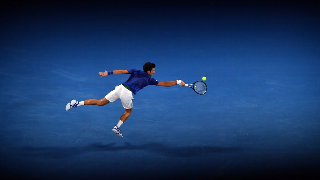 Serbia’s Novak Djokovic hits a return against Mitchell Krueger of the US during their men’s singles match on day two of the Australian Open. Photo: Paul Crock/Getty Images