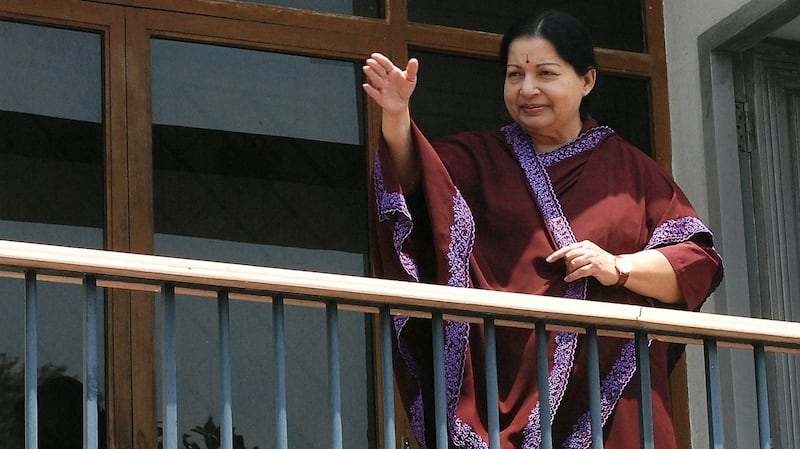 2011: All India Anna Dravida Munnetra Kazhagam (AIADMK) party general secretary, Jayaram Jayalalitha waves to supporters from the balcony of her residence after the party won the Tamil Nadu state election
