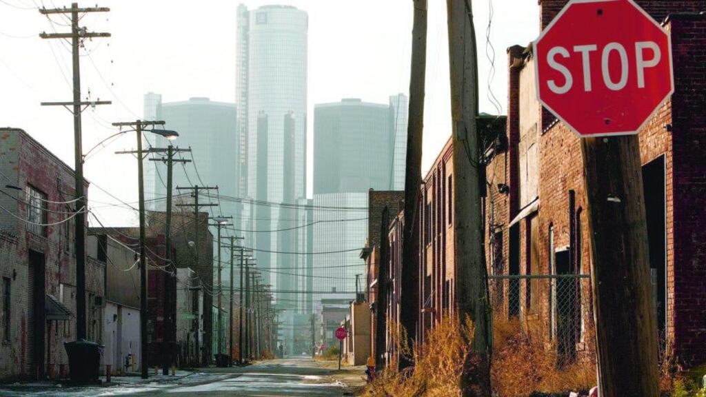 General Motors Corp headquarters in the background of a Detroit street. Photograph: Paul Sancya/AP