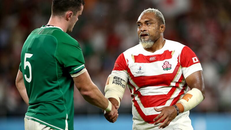 James Ryan shakes hands with Isileli Nakajima after Ireland’s defeat to Japan. Photograph: Cameron Spencer/Getty