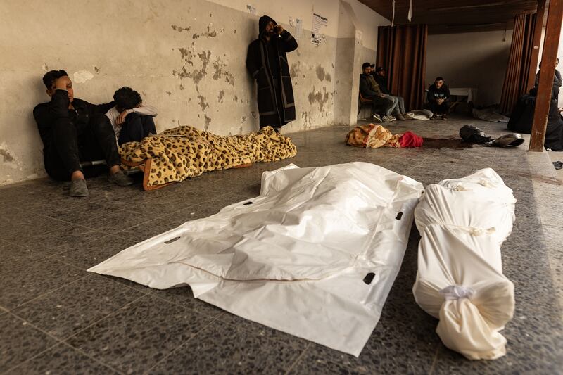 Mourners grieve over the bodies of members of the Al-Gharbawi family, who were killed in an Israeli air strike on the Al-Saftawi neighborhood, north of Gaza City, lst Thursday. Photograph: Saher Alghorra/New York Times