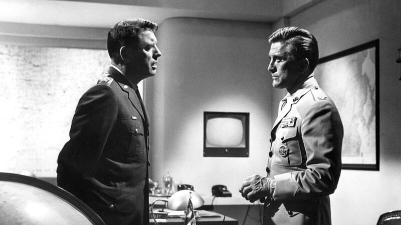 American actors Burt Lancaster and Kirk Douglas on the set of Seven Days in May, directed by John Frankenheimer. Photograph: Sunset Boulevard/Corbis via Getty