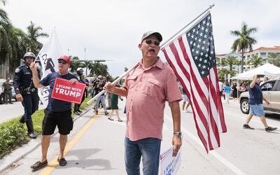 Supporters of former US president Donald Trump yell at an anti-Trump protester near the entrance to the Trump National Doral Miami golf course. Photograph: Justin Lane/EPA
