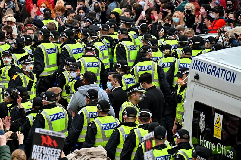 Protesters block an immigration van in Pollokshields, Glasgow, in May, 2021. Photograph: Jeff J Mitchell/Getty Images