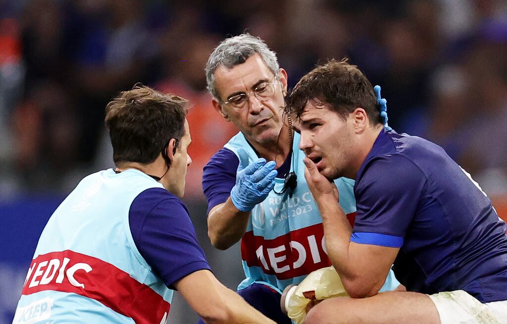 France captain Antoine Dupont receives medical treatment during the Rugby World Cup match at Stade Vélodrome, Marseille on Thursday. Photograph: David Rogers/Getty Images