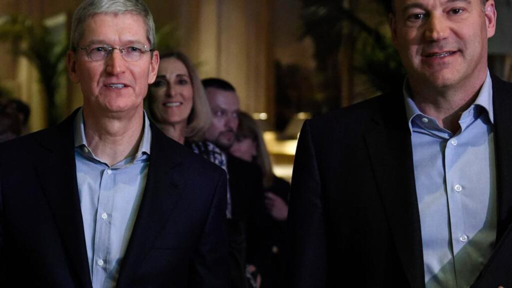 Tim Cook, chief executive officer of Apple arrives to speak with Gary Cohn, president and chief operating officer of Goldman Sachs Group (r) at the Goldman Sachs Technology And Internet Conference in San Francisco, California on Tuesday. Cook told the audience that he doesn’t believe “ in such laws as laws of large numbers”. (Photograph: David Paul Morris/Bloomberg)