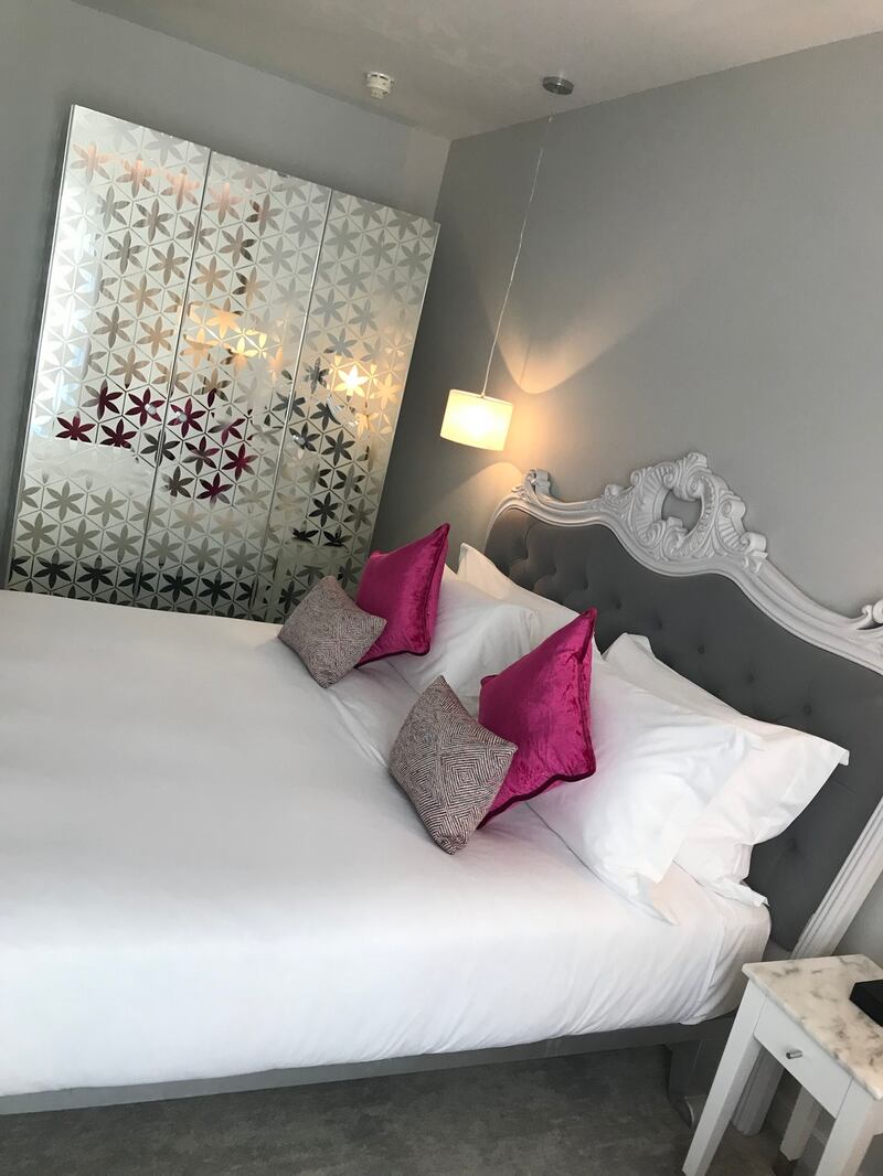 Bedrooms in the front wing have cool lime green tones, while those at the back have touches of berry pink