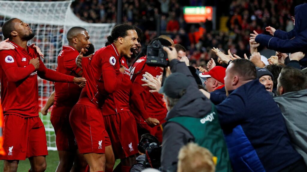 Liverpool celebrate their injury-time winner against Everton. Photograph: Reuters