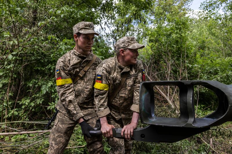 Ukrainian artillerymen use an American-made Howitzer artillery piece in the Donetsk region.