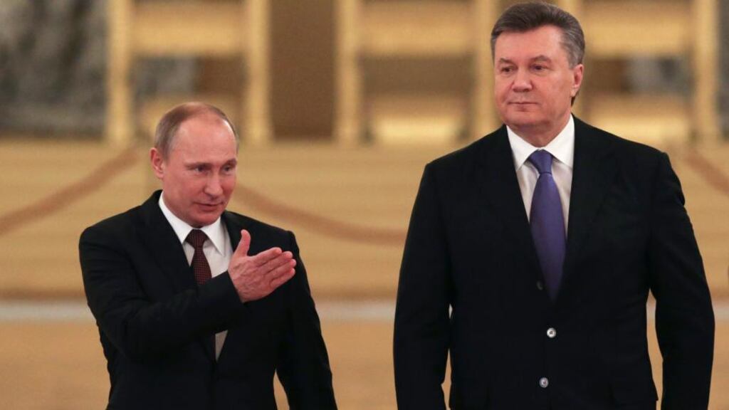 Russian president Vladimir Putin and his Ukrainian counterpart Viktor Yanukovych at the Kremlin in Moscow yesterday. Russia offered $15 billion in loans and a sharp discount on natural gas prices to Ukraine. Photograph: Sergei Karpukhin/Pool via The New York Times