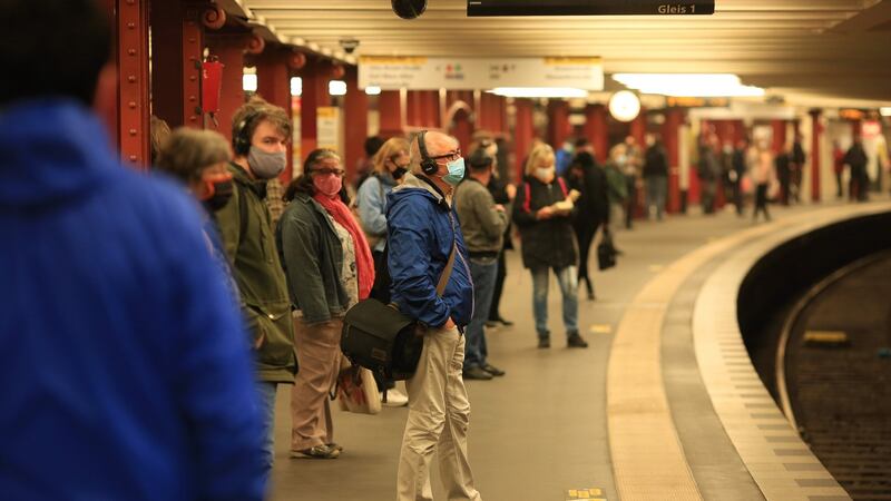 Commuters wear face masks as they wait for the U-Bahn at Alexanderplatz station in Berlin. Photograph: Krisztian Bocsi/Bloomberg