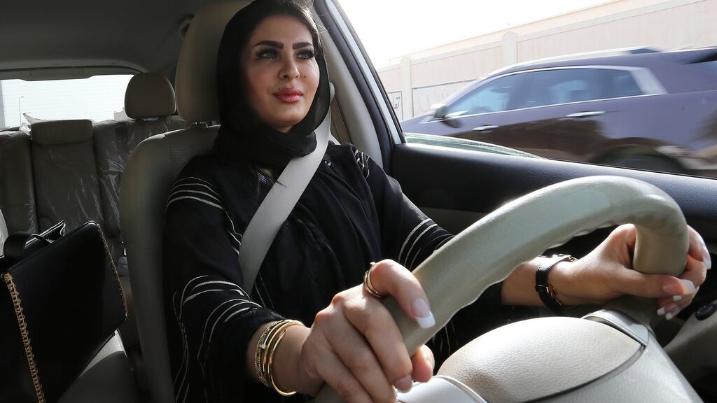 Huda al-Badri (30) poses behind the steering wheel of a car after Saudi Arabia eased its restrictions on women drivers in 2018. Photograph: Ahmed Yosri/EPA