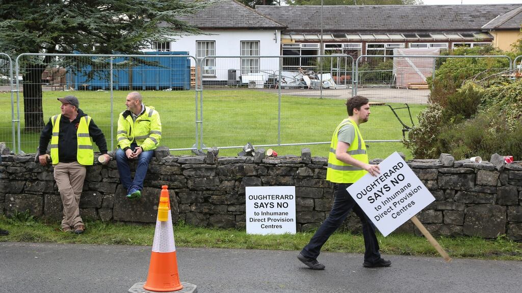 Some of the people taking part during a protest on Monday outside the former Connemara Gateway Hotel in Oughterard, Co Galway. Photograph: Joe O’Shaughnessy