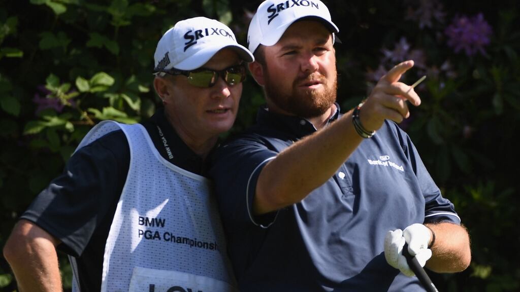 Shane Lowry and his caddie on the seventh hole during day one of the BMW PGA Championship at Wentworth. Photograph: Ross Kinnaird/Getty Images