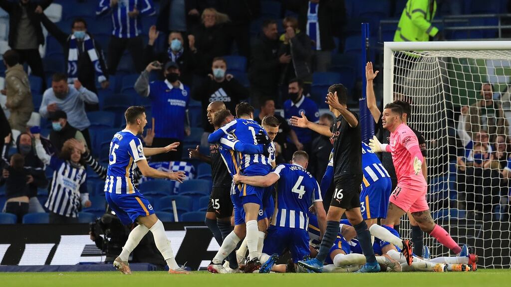 Brighton celebrate Dan Burn’s winner against Manchester City. Photograph: Gareth Fuller/Getty