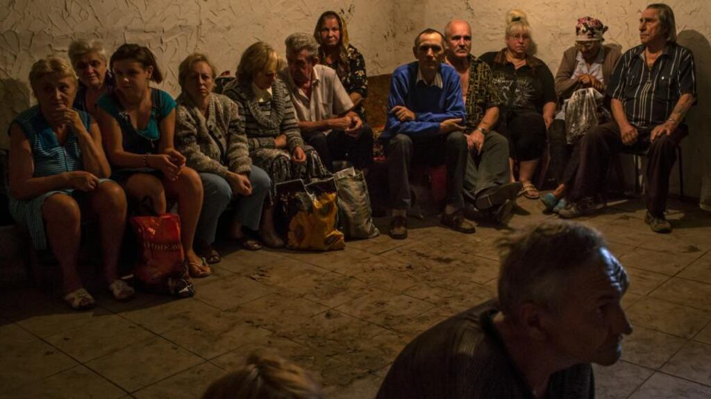 Civilians wait in a bomb shelter as Ukrainian troops resume shelling the town of Makiivka, near Donetsk in Ukraine, yesterday. Photograph: Mauricio Lima/The New York Times