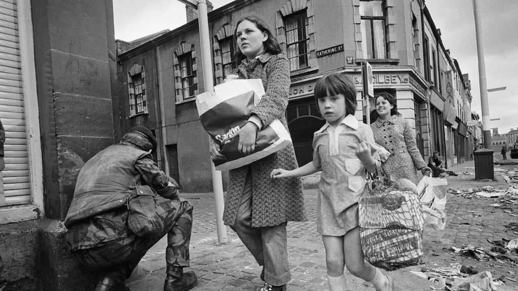 Pedestrians walk past soldiers in Belfast, Northern Ireland, after anti-internment riots on August 9th, 1971. Photograph: Alain Dejean/Sygma via Getty Images