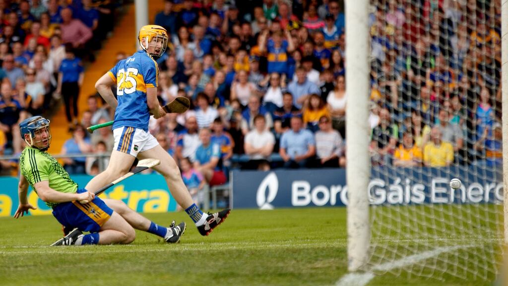 Clare goalkeeper Donal Tuohy and Tipp’s Jake Morris watch on as the substitute’s shot hits the post in a pivotal moment during yesterday’s game. Photograph: James Crombie