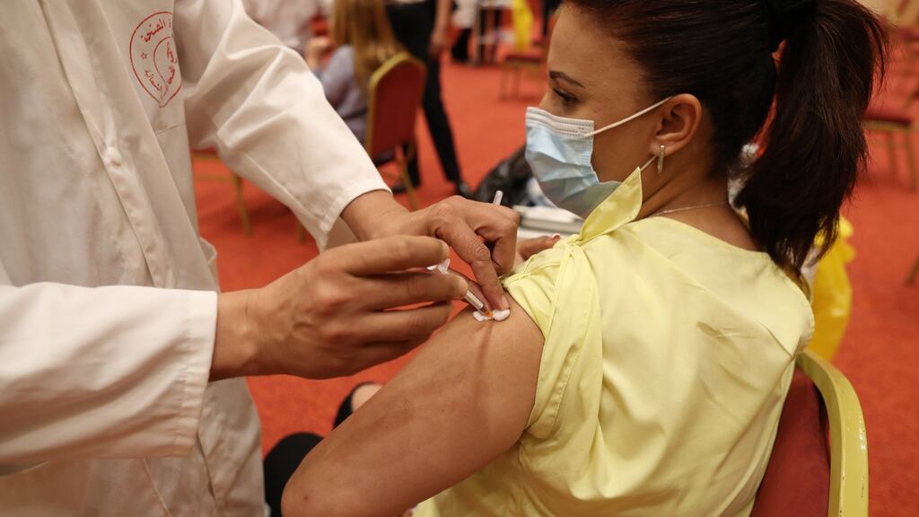 A Tunisian working in the tourism industry receives a dose of the Pfizer-BioNTech vaccine against Covid-19 last week. Photograph: Mohamed Messara/ EPA