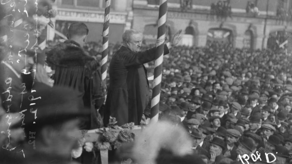 Thronged: John Redmond at the Parnell monumnet on O’Connell Street in 1912. Photograph courtesy of the National Library of Ireland